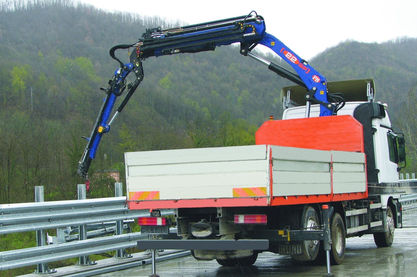 PM knuckle boom crane mounted on a truck